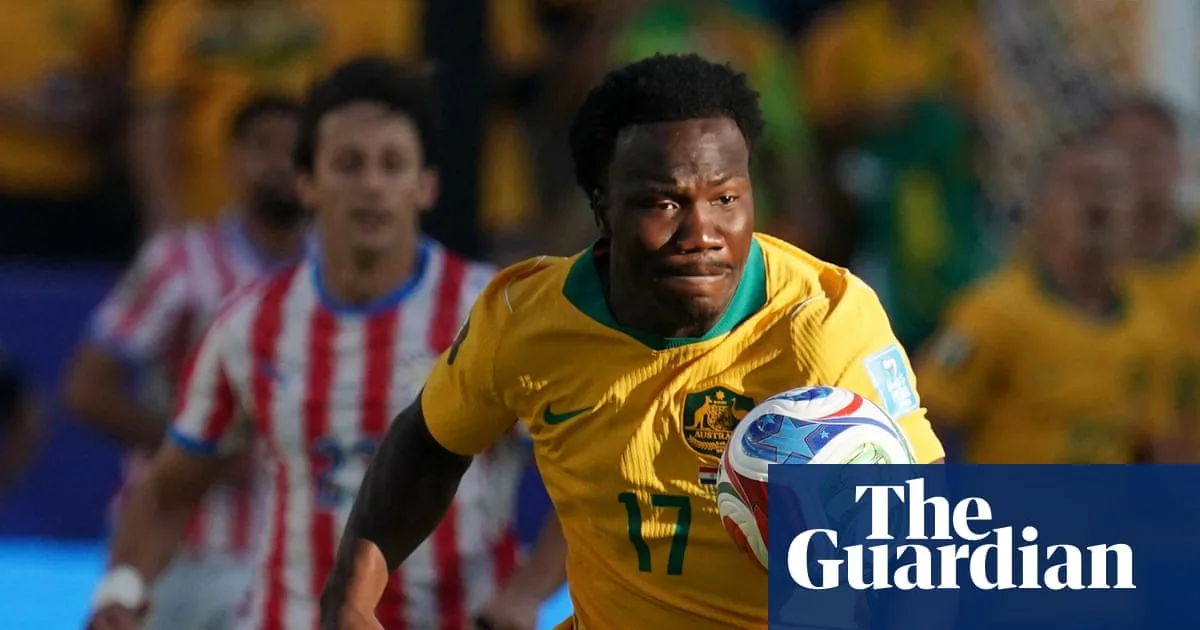 Socceroos secure place in World Cup last 32 after goalless draw with Paraguay
