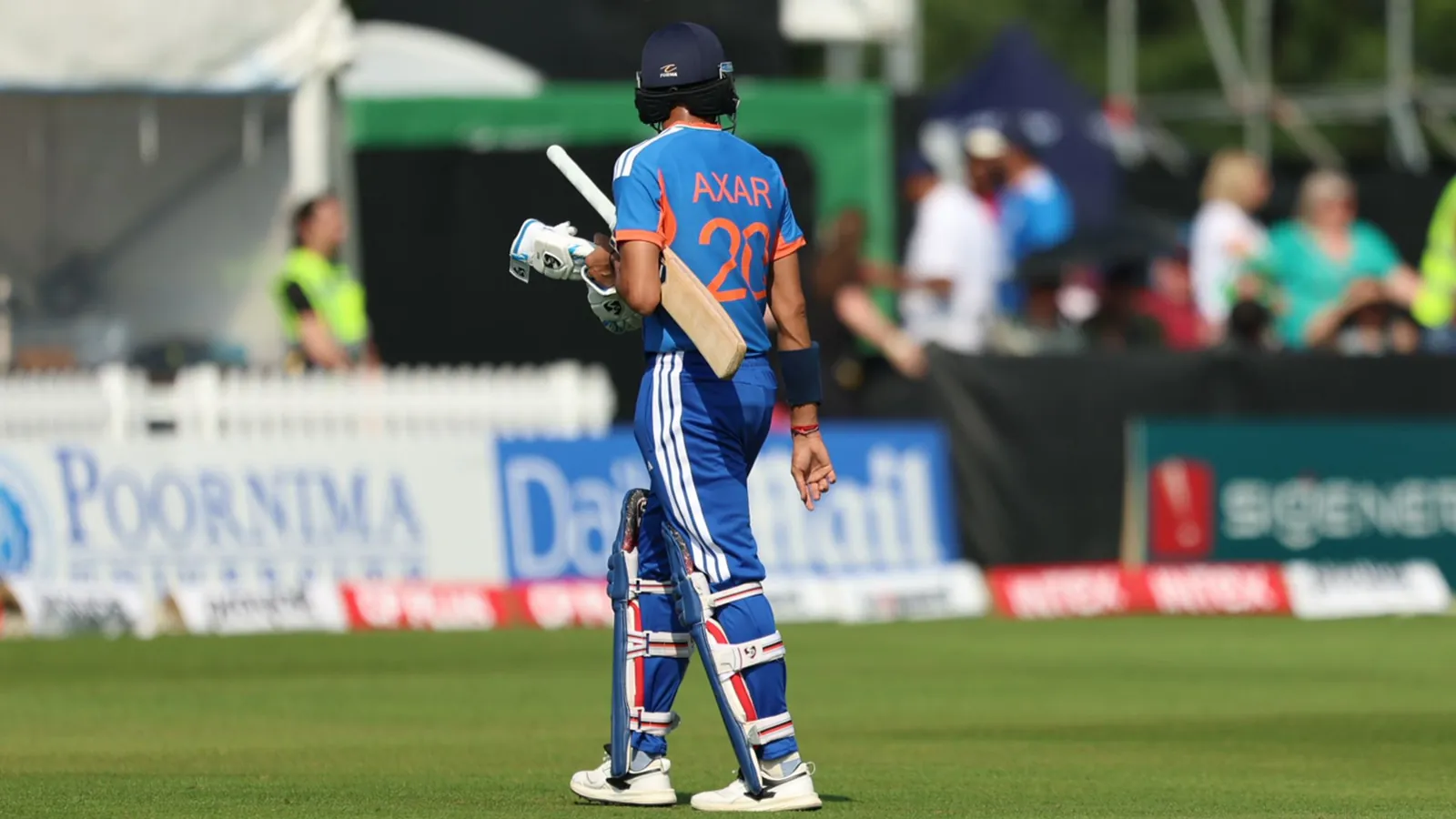 Axar Patel looks walks from the crease as his side were bowled out for 148 runs in the 19th over