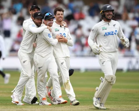Mitchell Santner and Tom Latham celebrate after the dismissal of Jamie Smith
