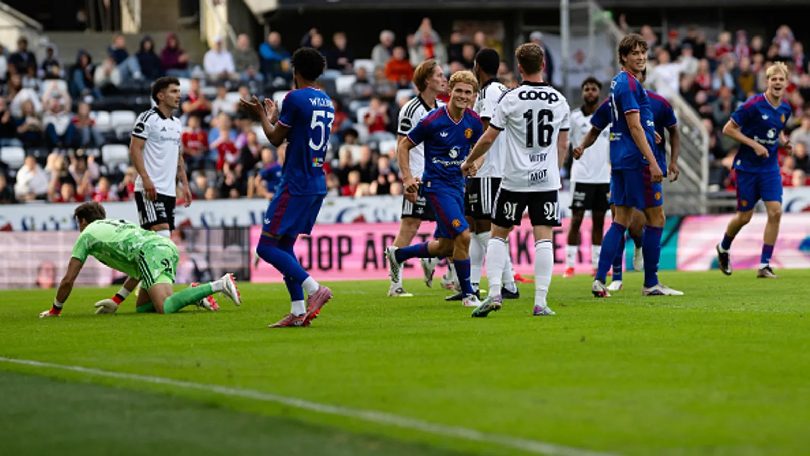 TRONDHEIM, NORWAY - JULY 24: Jacob Devaney of Manchester United celebrates scoring their third goal during the pre-season friendly match between Rosenborg and Manchester United at Lerkendal Stadion on July 24, 2026 in Trondheim, Norway. (Photo by Ash Donelon/Manchester United via Getty Images)