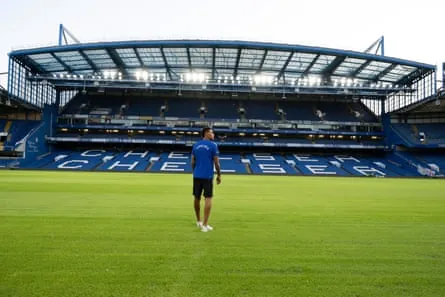 Morgan Rogers walks on the pitch at Stamford Bridge.