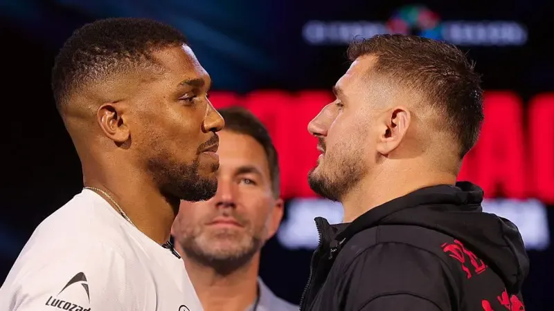 Anthony Joshua faces off with Kristian Prenga