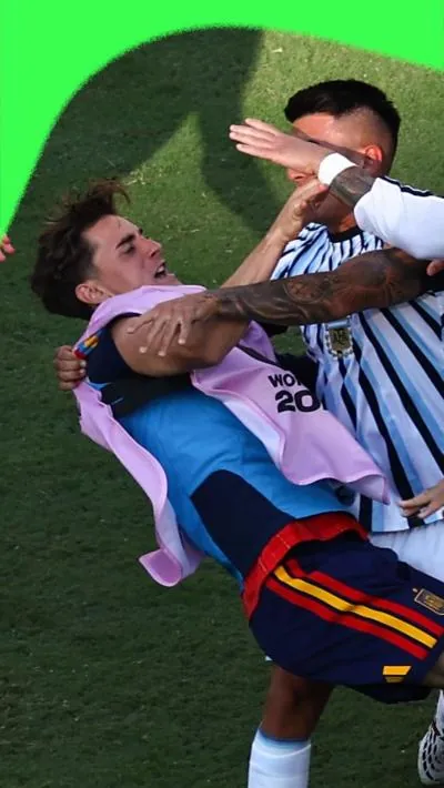 Spain player being pushed to the floor