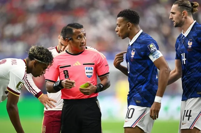 ARLINGTON, TEXAS - JULY 14: Captain Kylian Mbappe #10 of France protests to Referee Ivan Barton on his penalty decision after Lucas Digne #3 of France fouls Lamine Yamal #19 of Spain in the penalty box during the FIFA World Cup 2026 Semi Final match between France and Spain at Dallas Stadium on July 14, 2026 in Arlington, Texas. (Photo by Hannah Peters - FIFA/FIFA via Getty Images)
