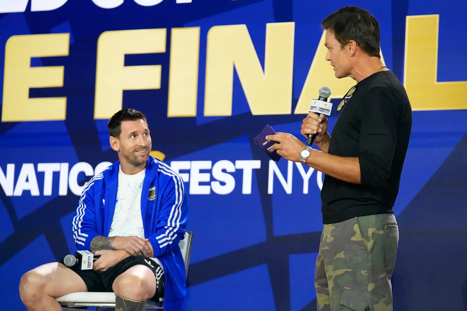Argentina's Lionel Messi listens to former NFL player Tom Brady during a news conference ahead of the World Cup final soccer match between Spain and Argentina in New York, Friday, July 17, 2026. (AP Photo/Frank Franklin II)