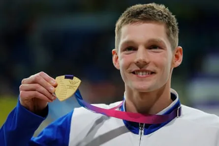 Gold medalist Duncan Scott of Scotland poses for a photo after the medal ceremony for the men’s 200m individual medley final.