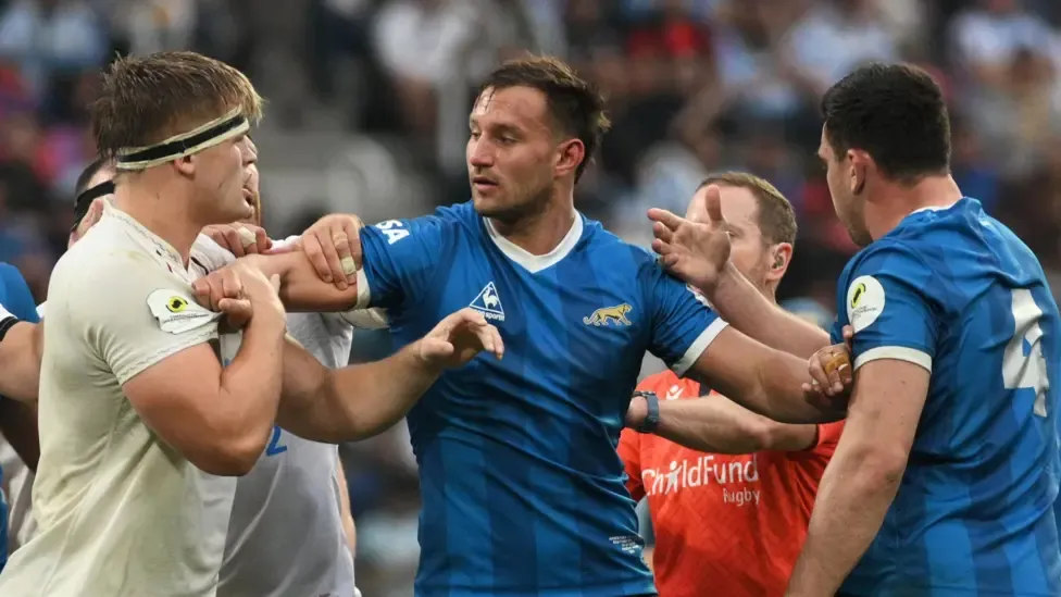 England's Guy Pepper clashes with Argentina's Joaquin Moro and Guido Petti