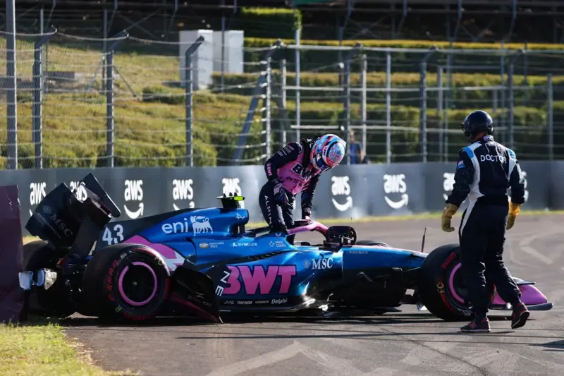 Franco Colapinto climbs out of his damaged Alpine after crashing in Hungarian Grand Prix second practice