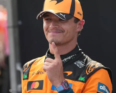 McLaren’s Lando Norris indicates he’s No 1 by pointing his finger up