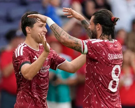 Federico Chiesa celebrates with Dominik Szoboszlai after scoring Liverpool's third goal against Sunderland in Nashville