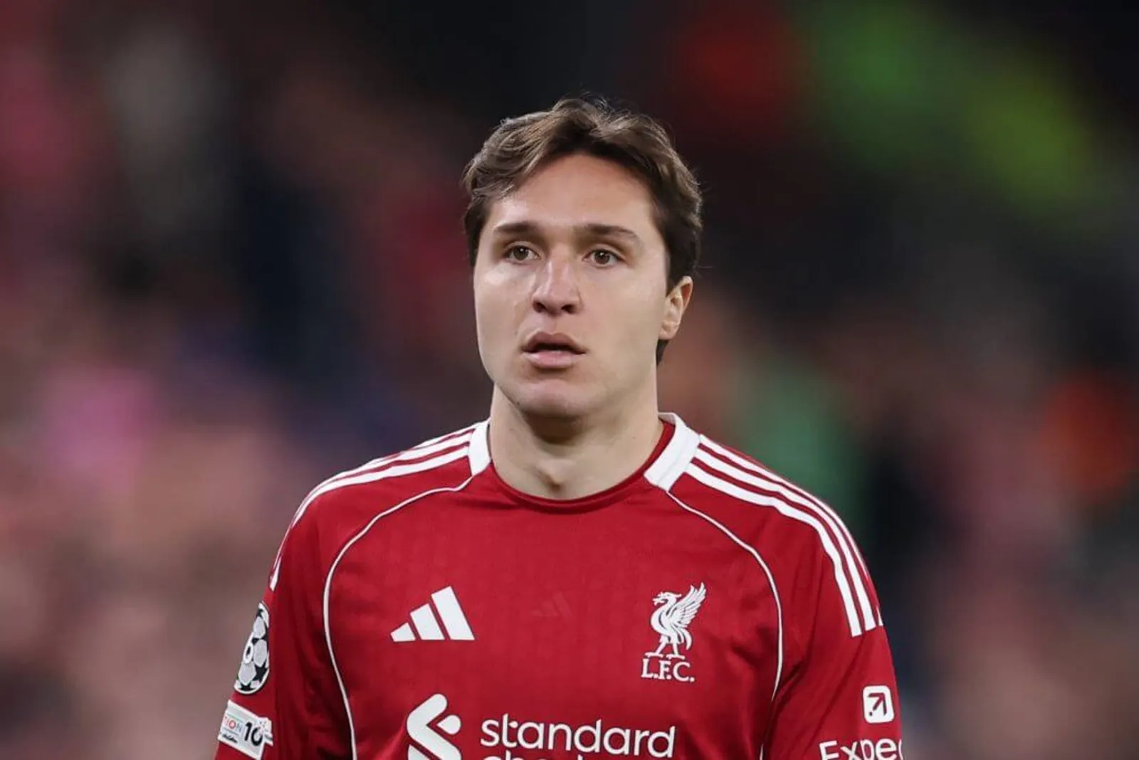 Federico Chiesa looks on while in action for Liverpool, wearing the team's red home shirt