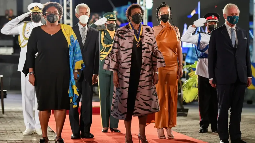 Sir Garfield Sobers (third left, white mask) attends the presidential inauguration ceremony as Barbados formally becomes a republic, flanked by prime minister Mia Mottley, president Dame Sandra Mason, singer Rihanna and Prince Charles
