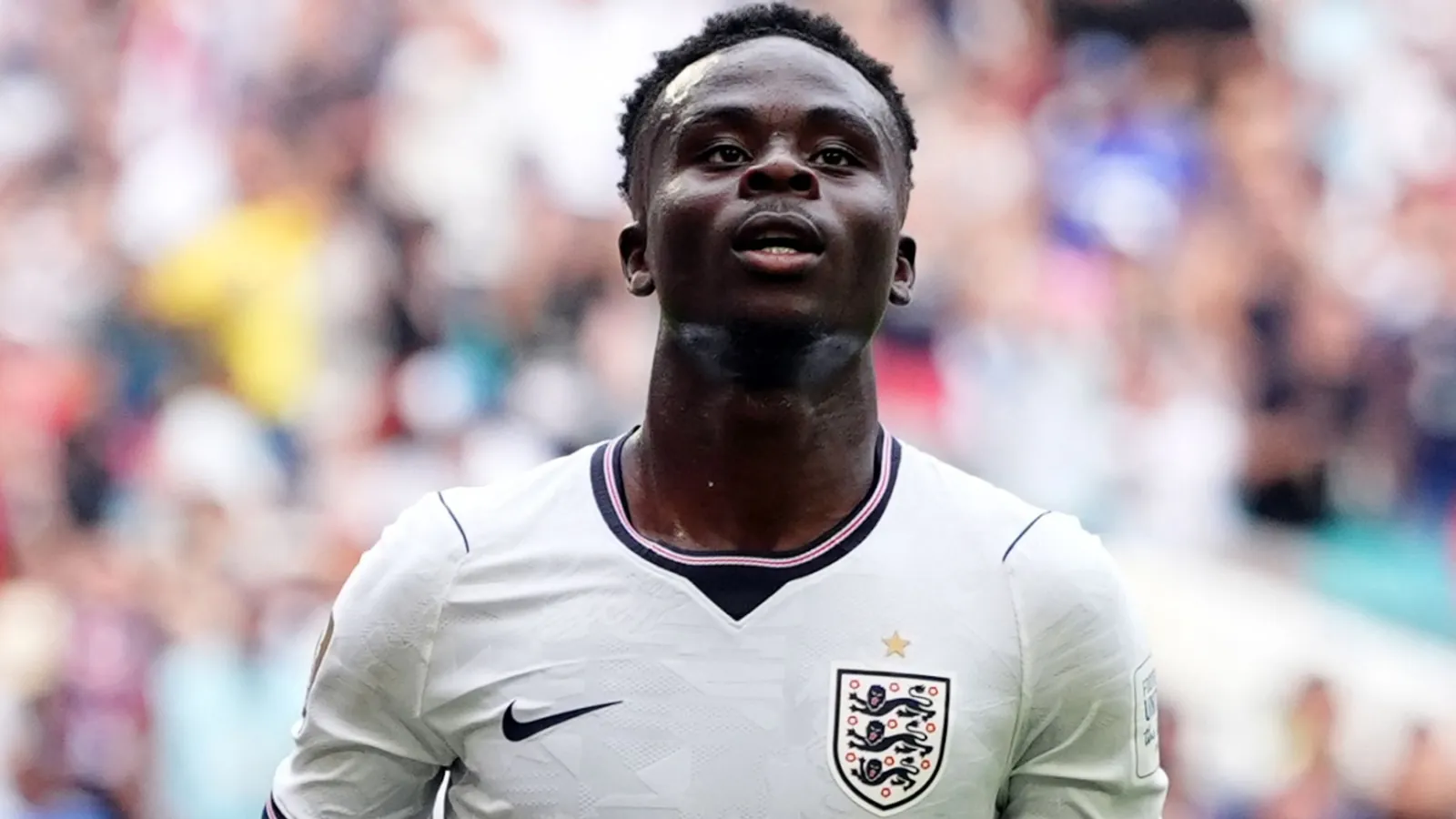 Bukayo Saka celebrates for England against France