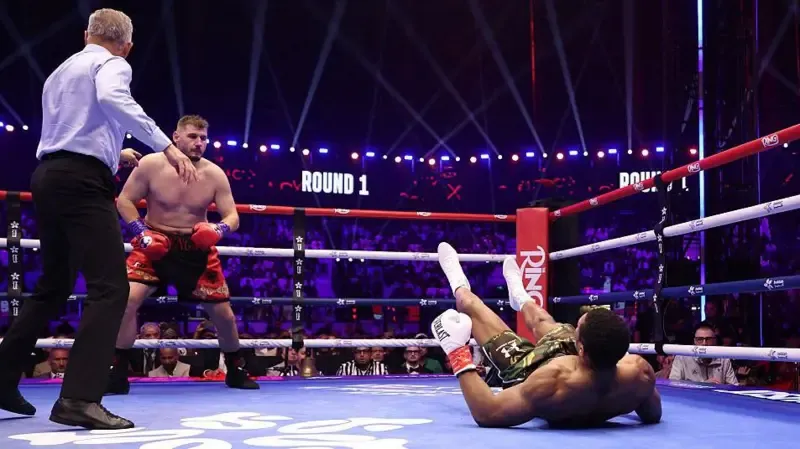 Anthony Joshua on the canvas after being dropped by Kristan Prenga