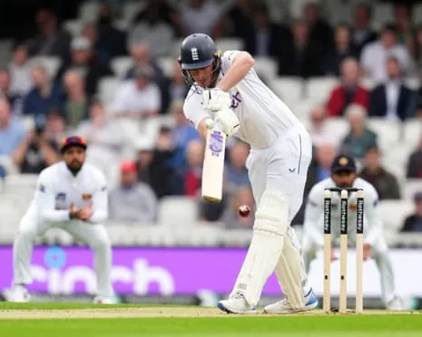 Dan Lawrence bats during a Test match at The Oval, ball near his bat.