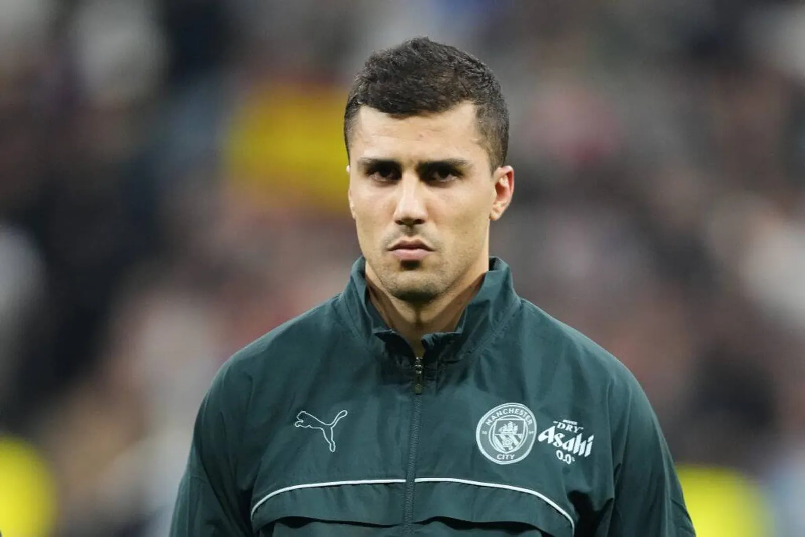 Image of Rodri lining up in a Manchester City tracksuit